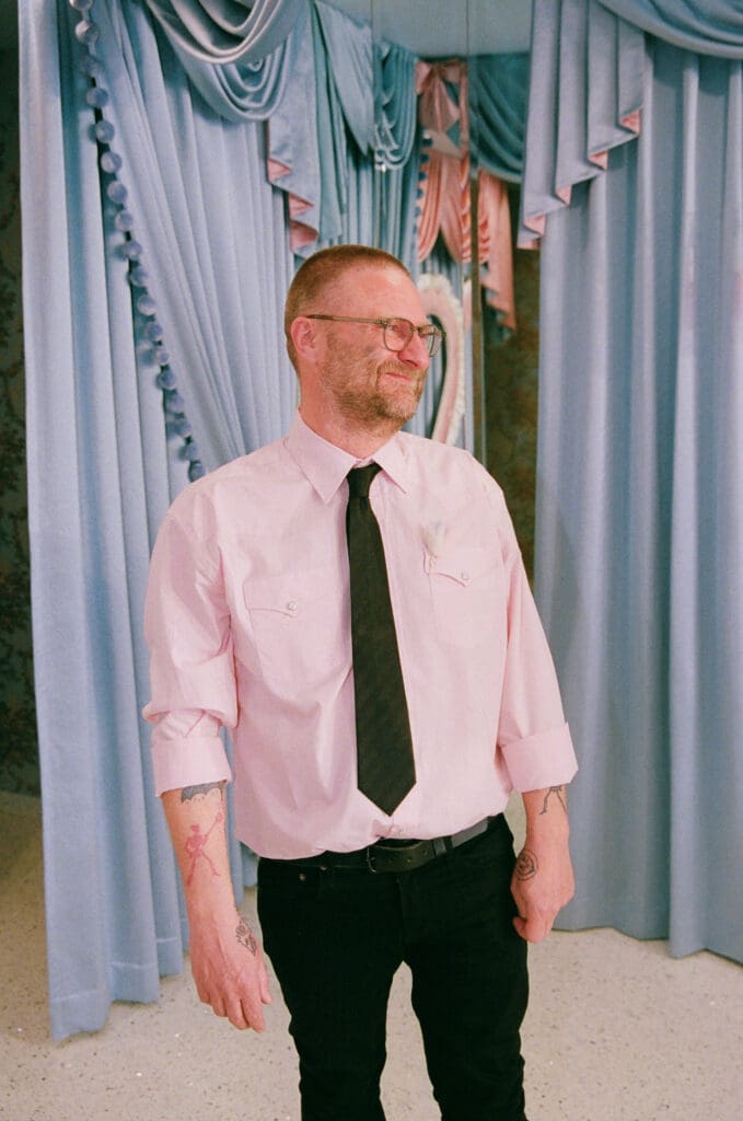 groom watching the bride walk down the aisle
