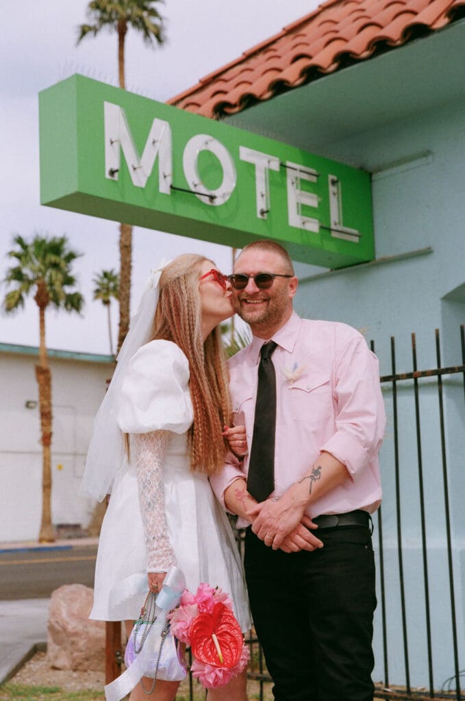 bride kissing the groom on the cheek