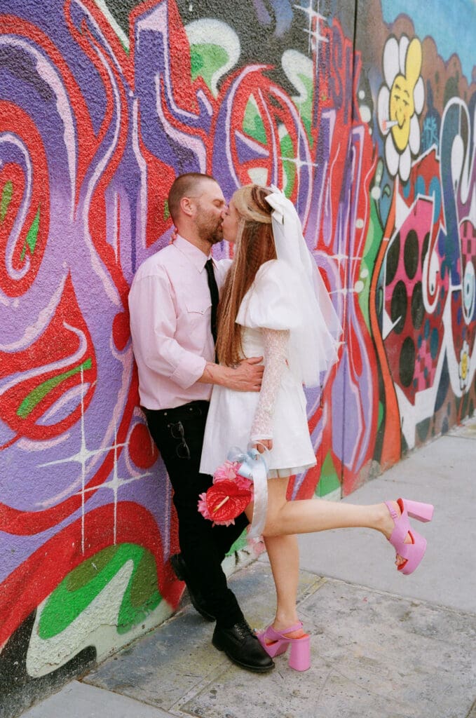 portrait of the newlyweds kissing