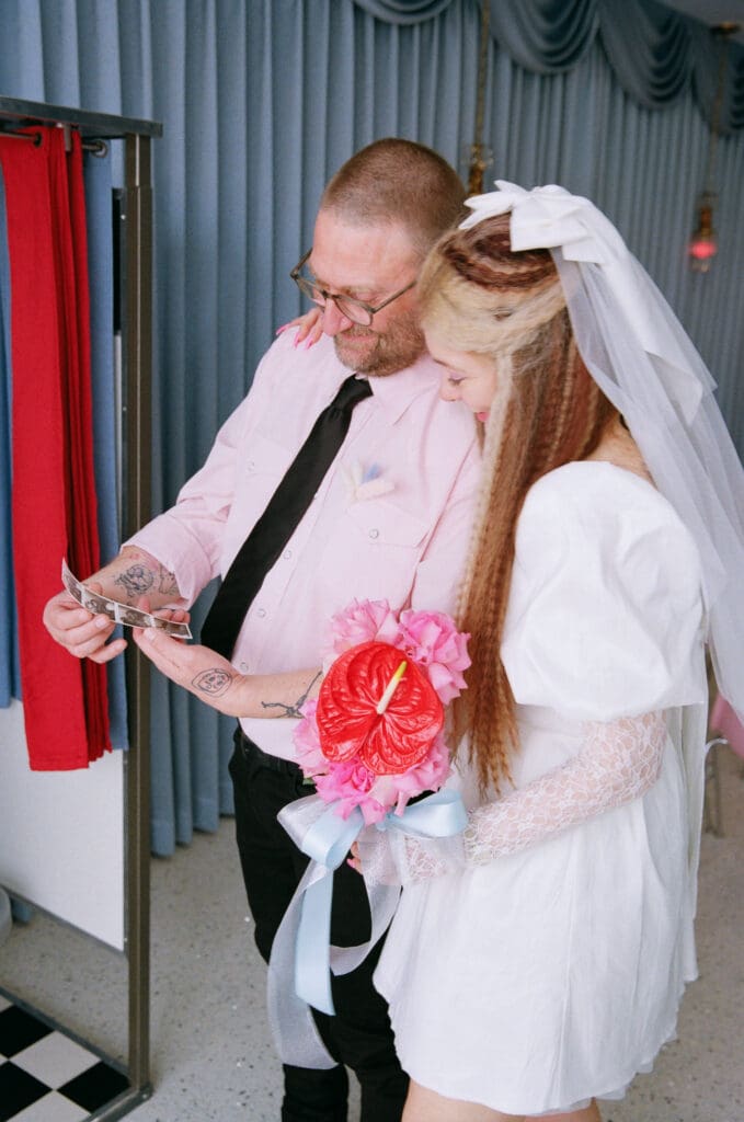 cute couple at a photo booth during their session