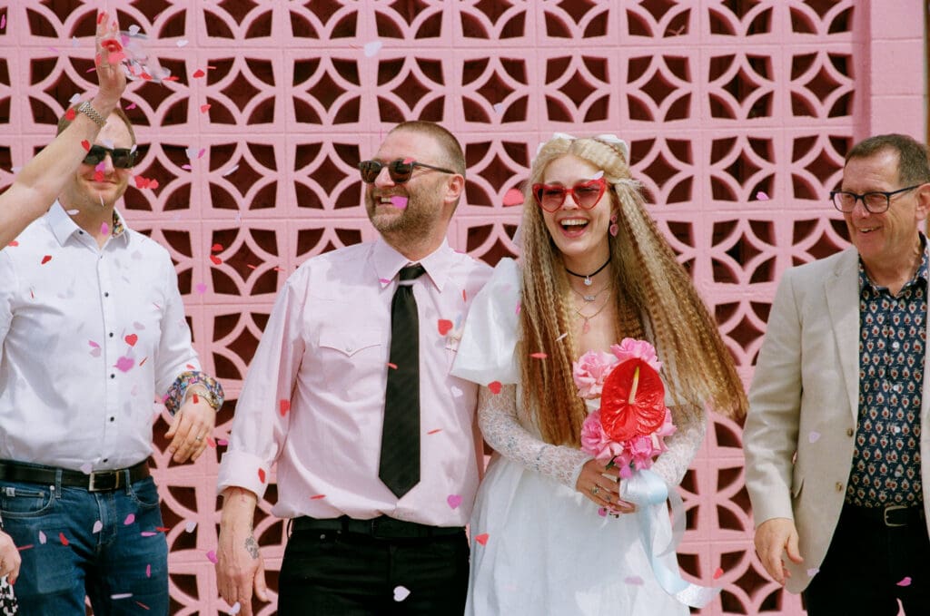 happy couple celebrating their elopement with their family members