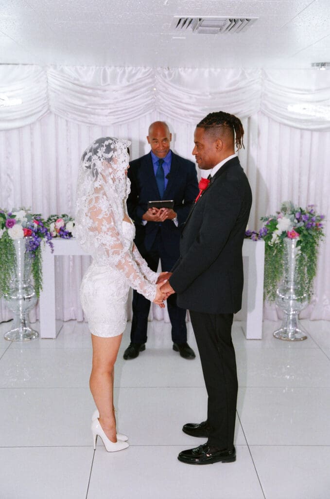 bride and groom holding hands during their elopement cermeony