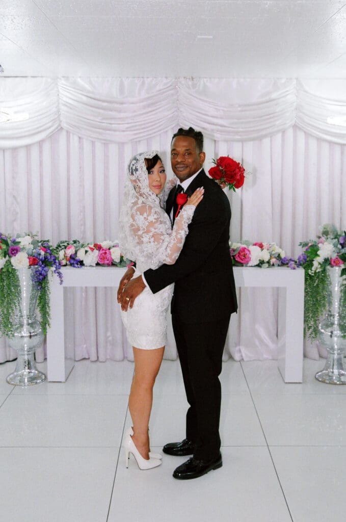 cute portrait of the bride and groom hugging during their session