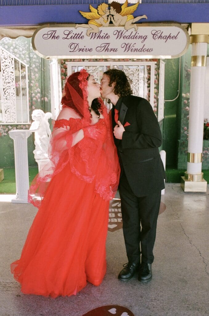 portrait of the newlyweds kissing