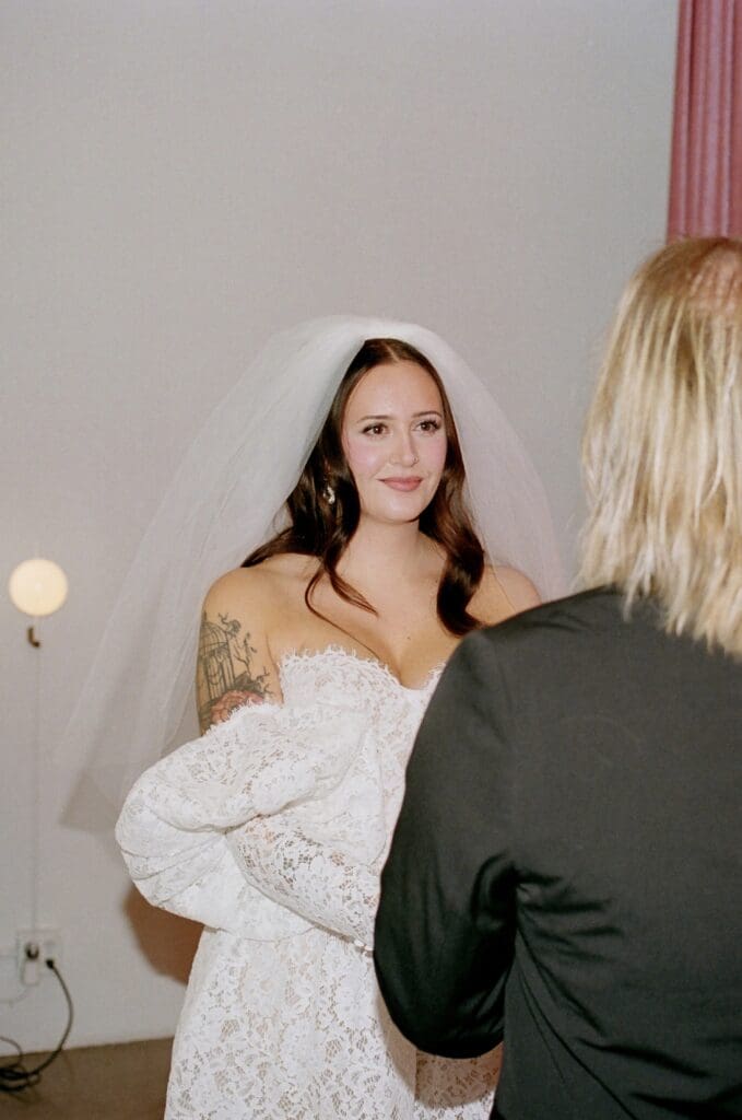 bride and groom holding hands during their ceremony
