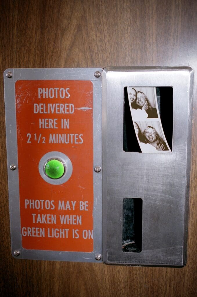cute picture of the newlyweds at a photobooth