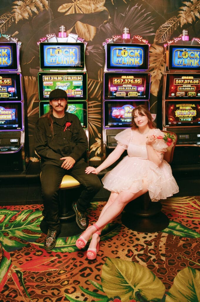 couple at a casino during their bridal portraits 