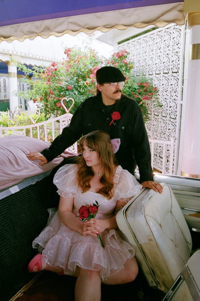 cute picture of the bride and groom at little white wedding chapel
