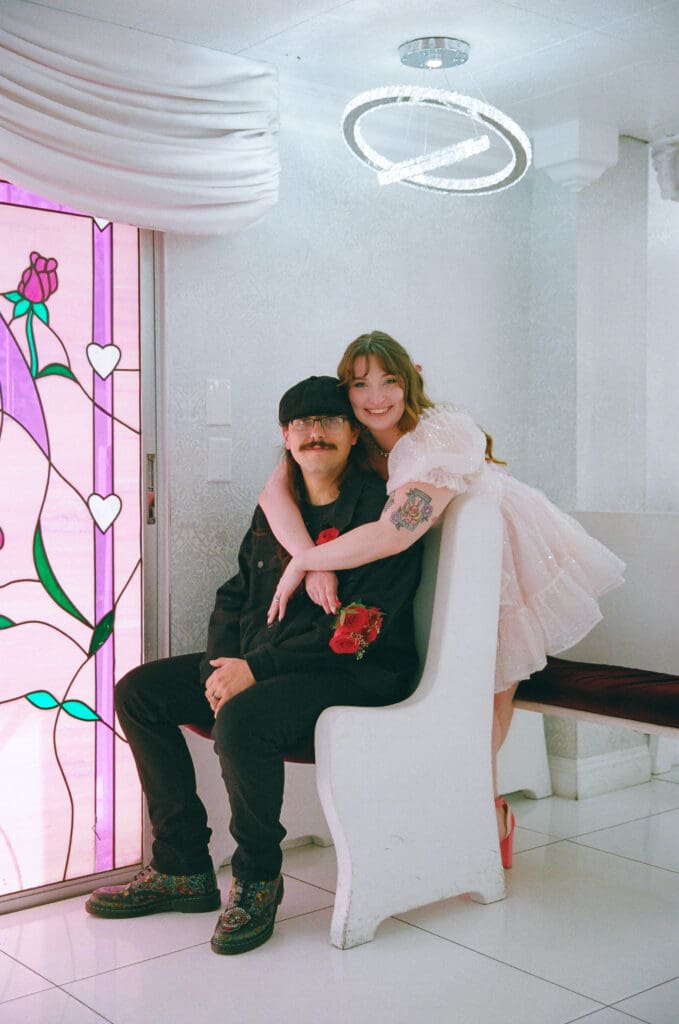 couple smiling at the camera during their photoshoot