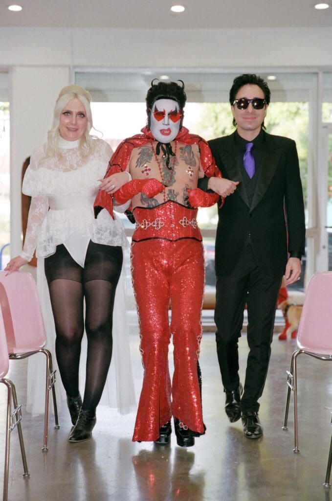 couple walking down the aisle with hellvis