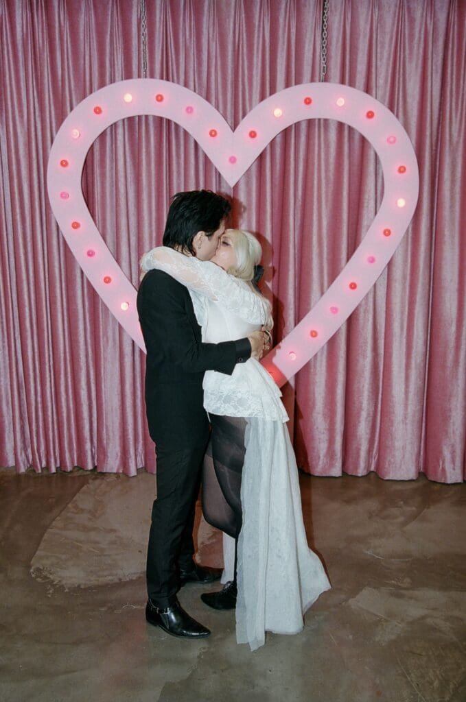 picture of the bride and groom kissing after their ceremony