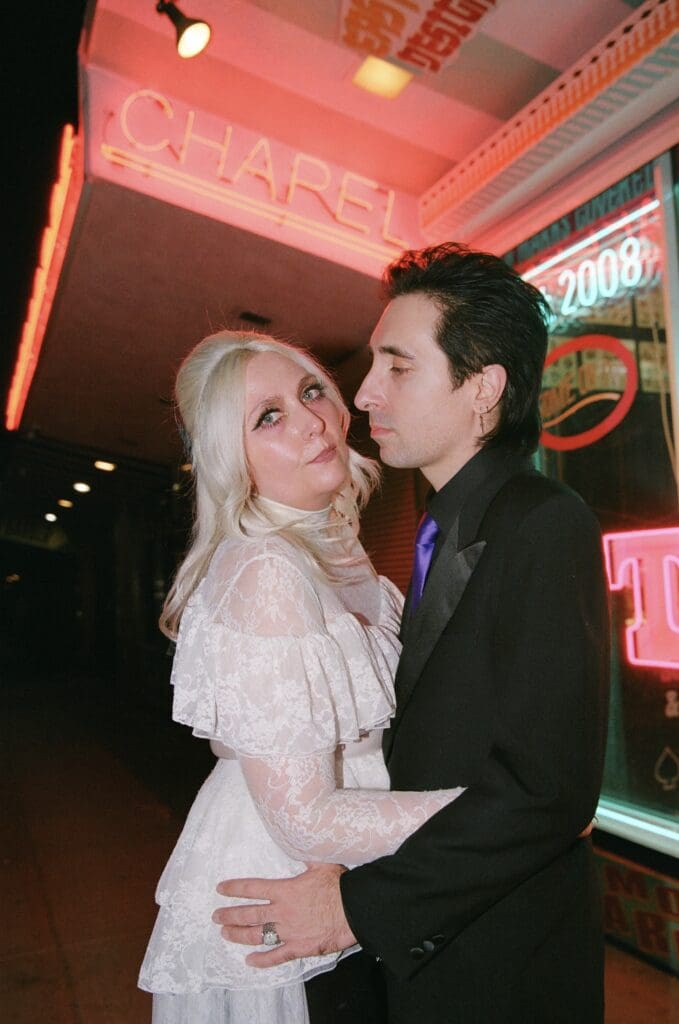 groom kissing the bride on the cheek