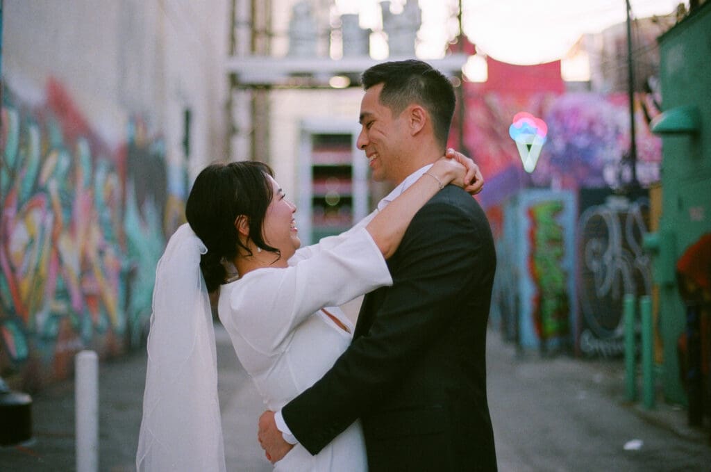 cute couple laughing with each other during their photoshoot
