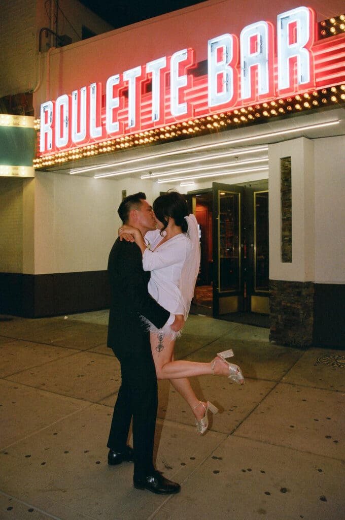 portrait of the newlyweds kissing during their photoshoot