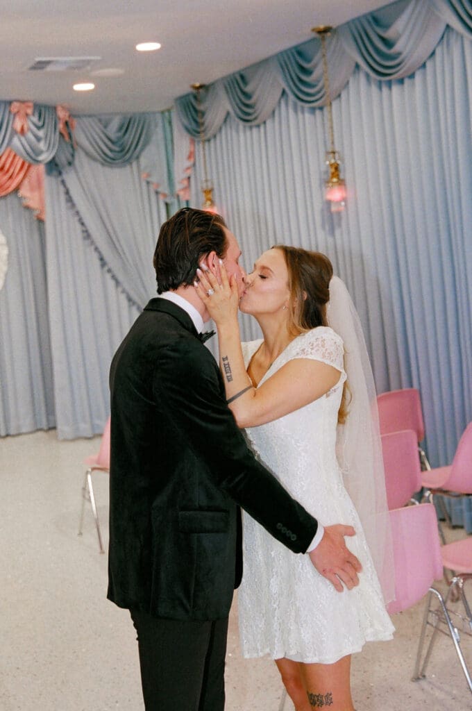 Bride and groom, kissing after their ceremony