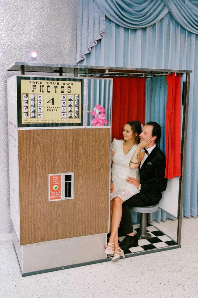 cute couple at a photo booth after their ceremony