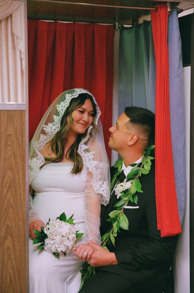 bride and groom smiling at each other during their photoshoot