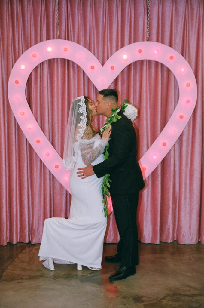 portrait of the newlyweds kissing