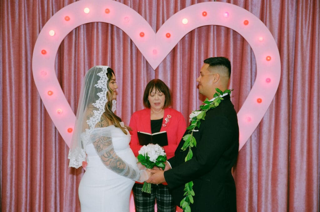 bride and groom holding hands during their elopement ceremony