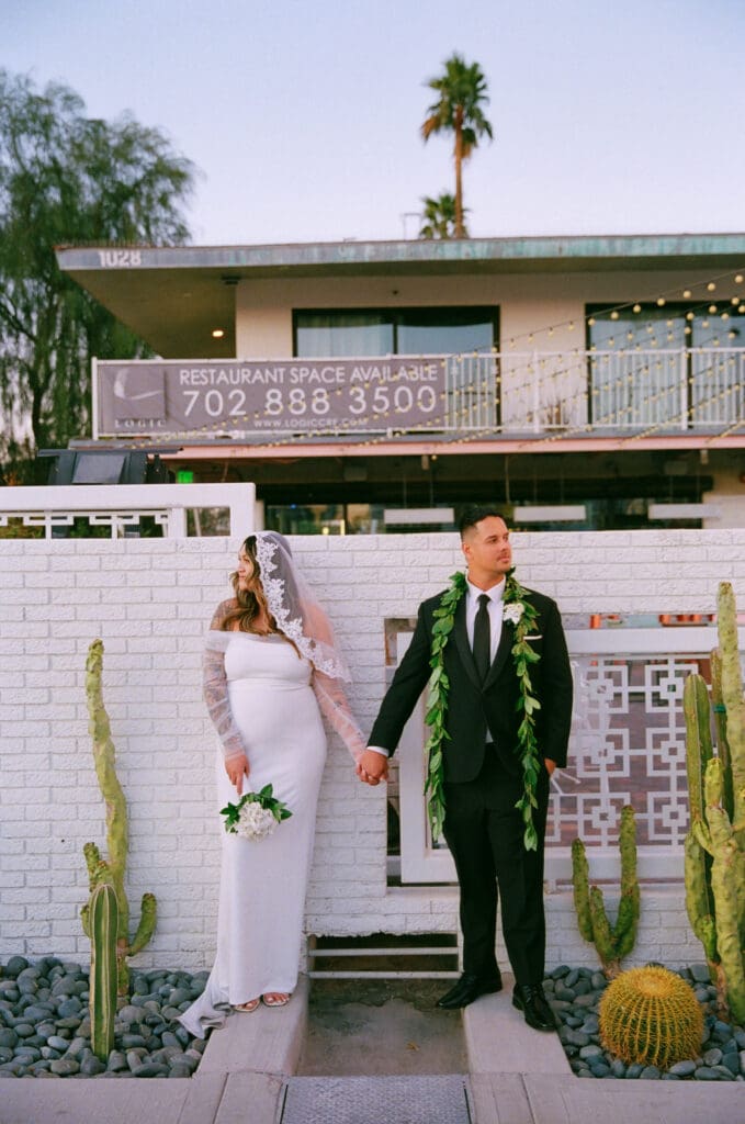 picture of the bride and groom holding hands