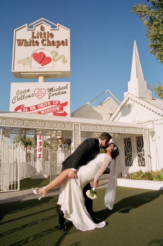 Picture of the newlyweds kissing during their bridal portraits