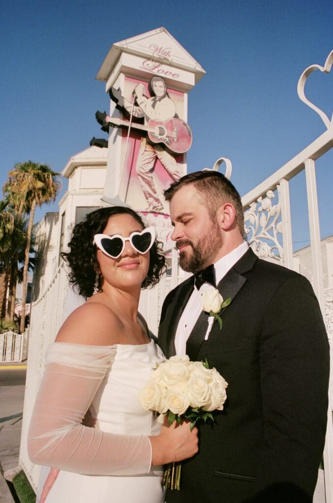 Picture of the groom, smiling at the bride