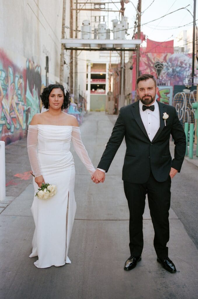 Cute couple walking around downtown Las Vegas during their bridal portraits