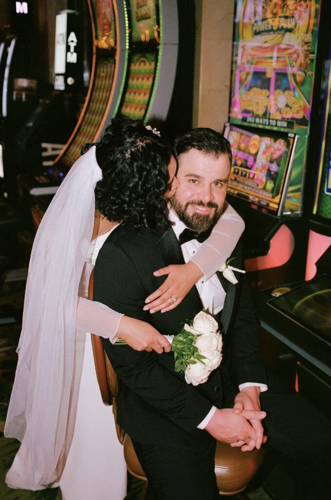 Bride, kissing the groom on the cheek