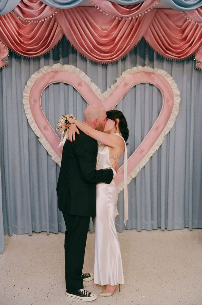 bride and groom, kissing after their wedding ceremony