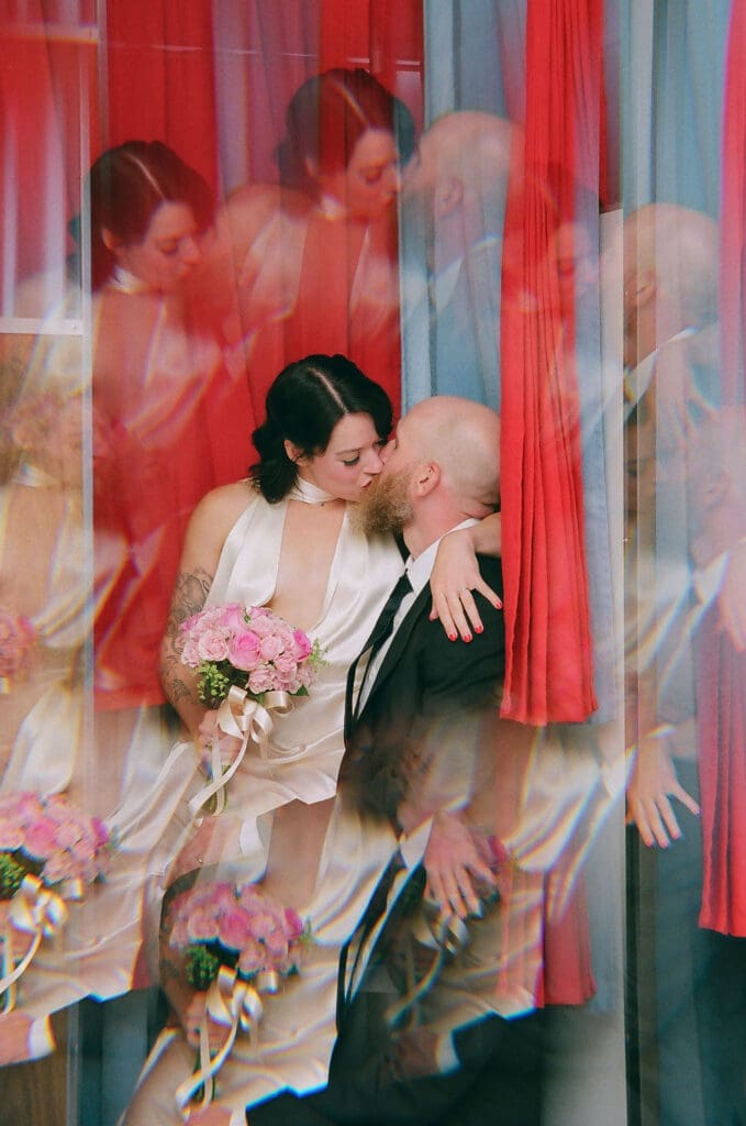 Portrait of the newly married couple kissing during their bridal portraits