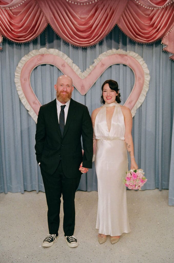Couple smiling at the camera during their bridal portraits