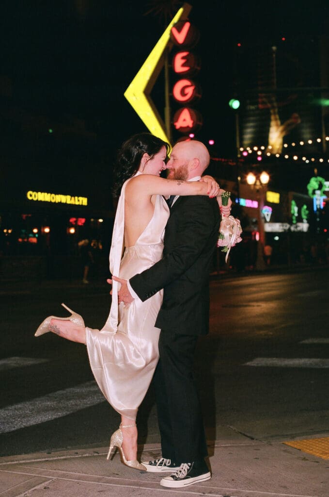 portrait of the newlyweds kissing