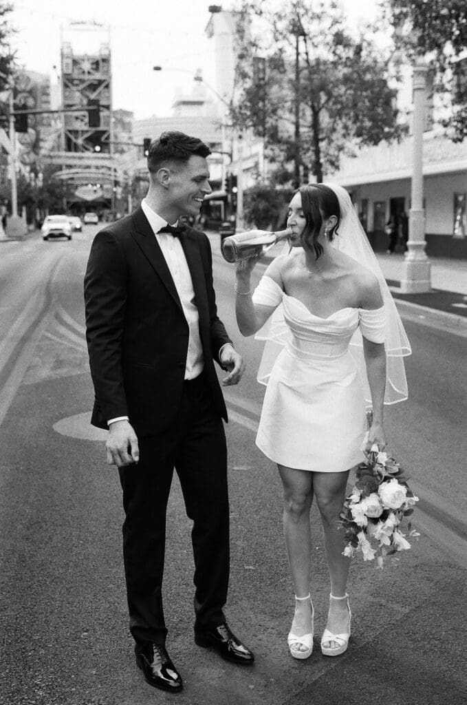 couple celebrating their elopement with champagne