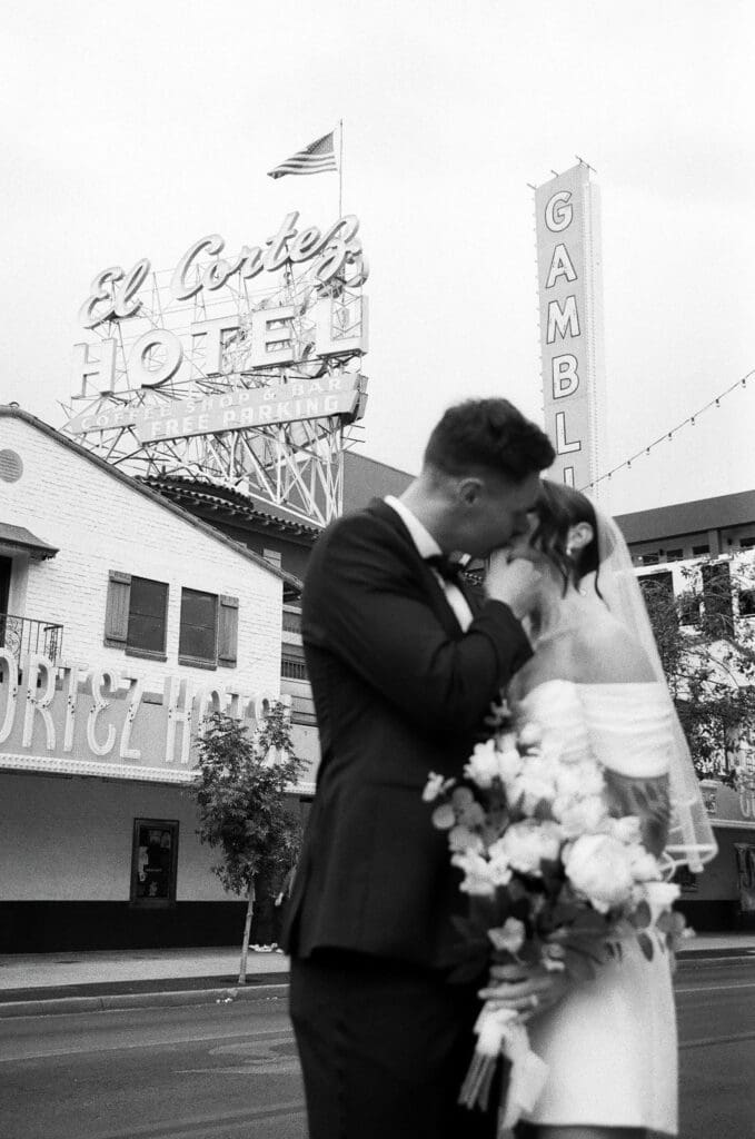 groom kissing the bride on the forehead