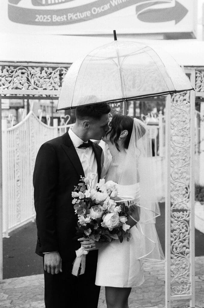 portrait of the newlyweds kissing after their ceremony