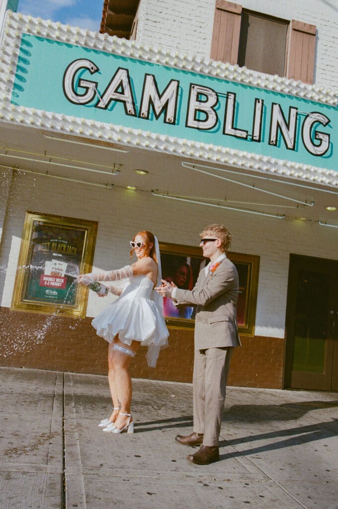 couple celebrating their elopement with champagne