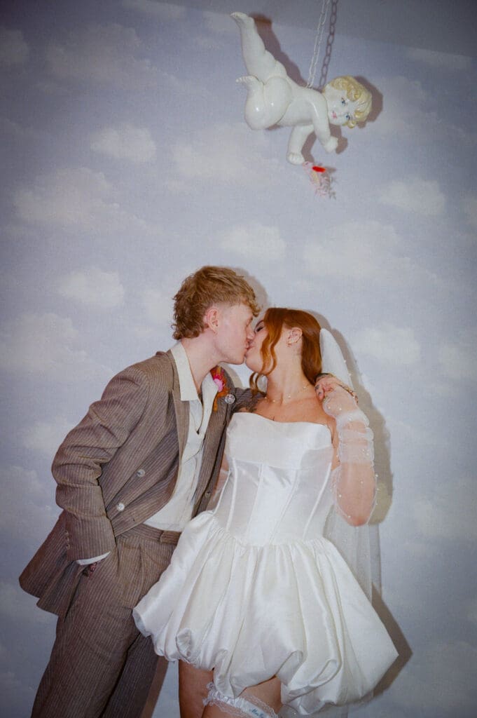 portrait of the newly married couple kissing