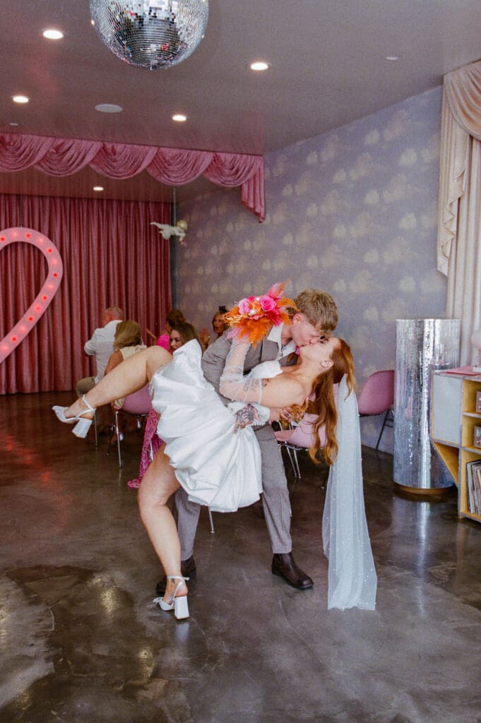 couple kissing after their dream wedding ceremony