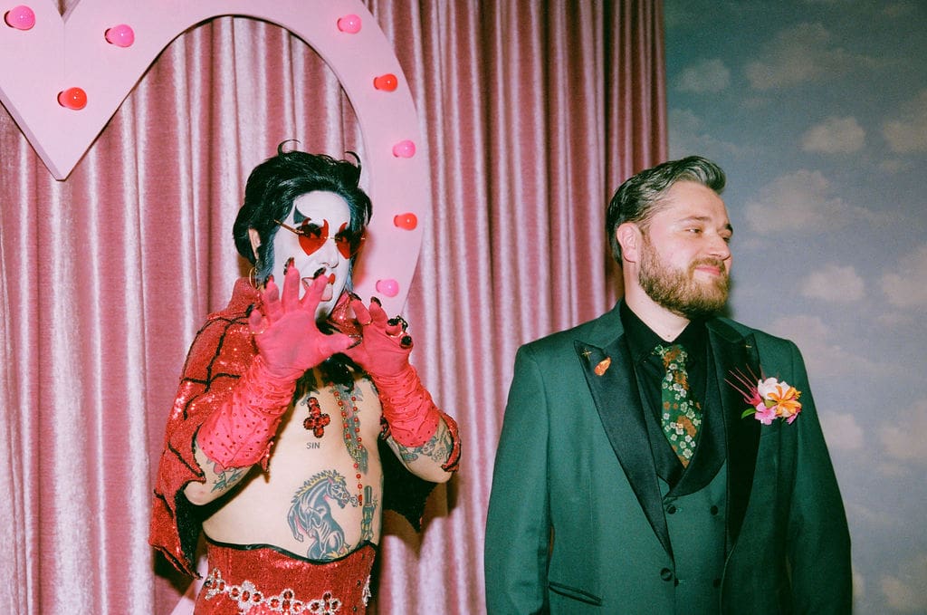 groom watching the bride walking down the aisle