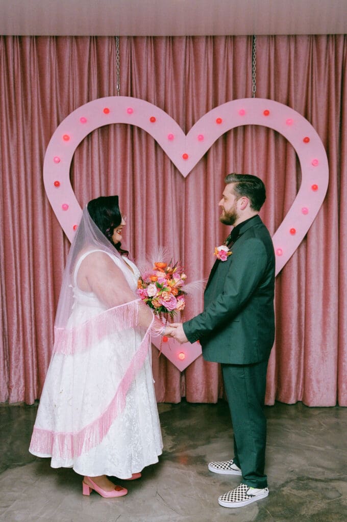 bride and groom holding hands during their wedding ceremony