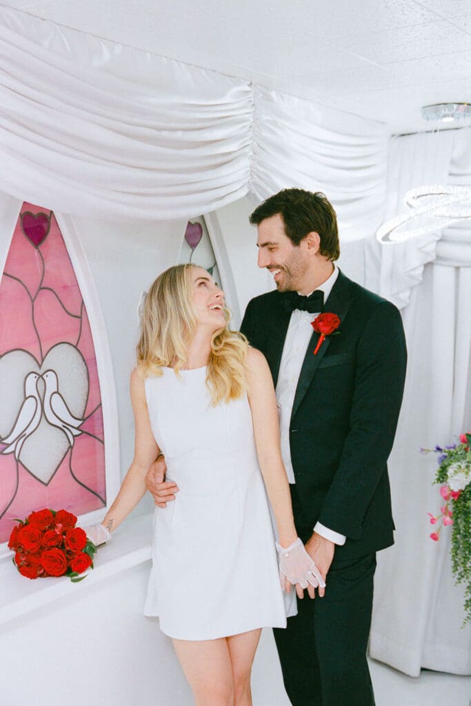 portrait of the newlyweds laughing with each other
