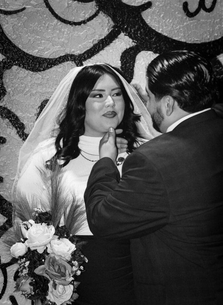 picture of the bride and groom smiling at each other