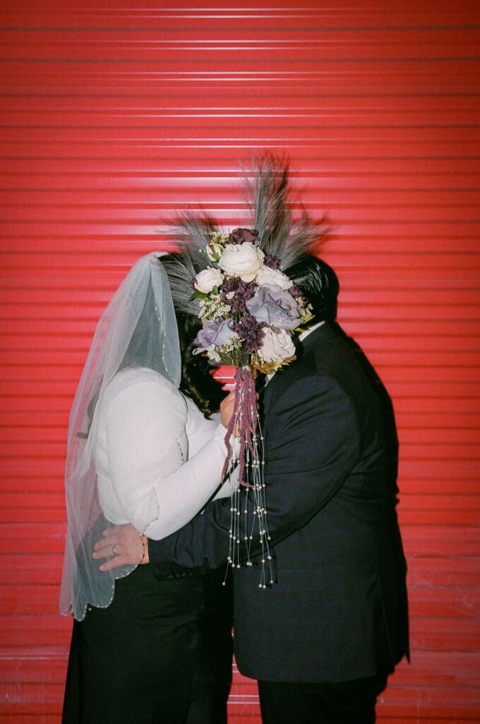 cute picture of the bride and groom kissing