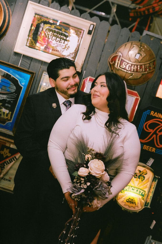 groom kissing the bride on the cheek