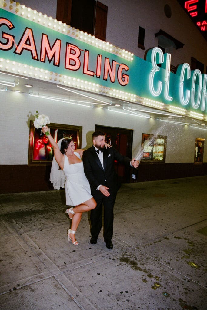 newlyweds celebrating their elopement with champagne