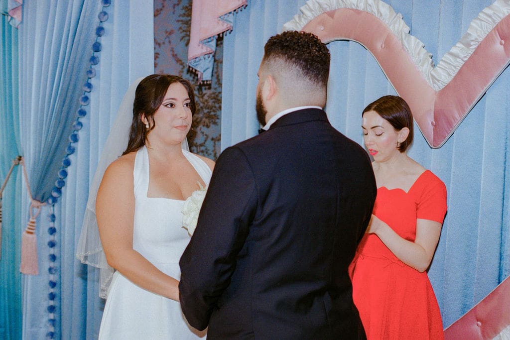bride and groom holding hands during their ceremony