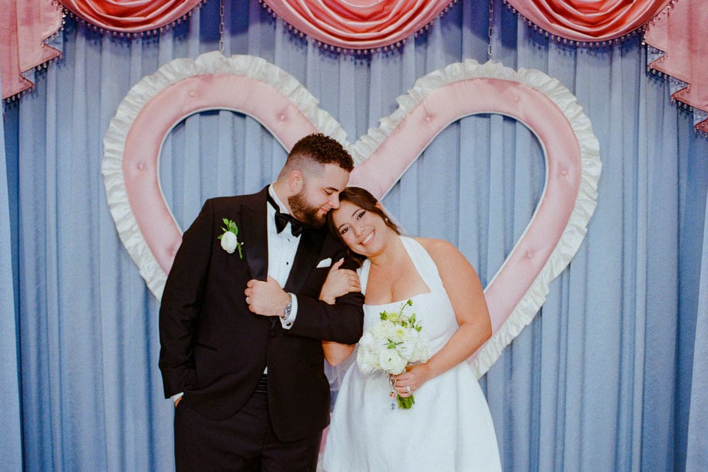 groom kissing the bride on the forehead