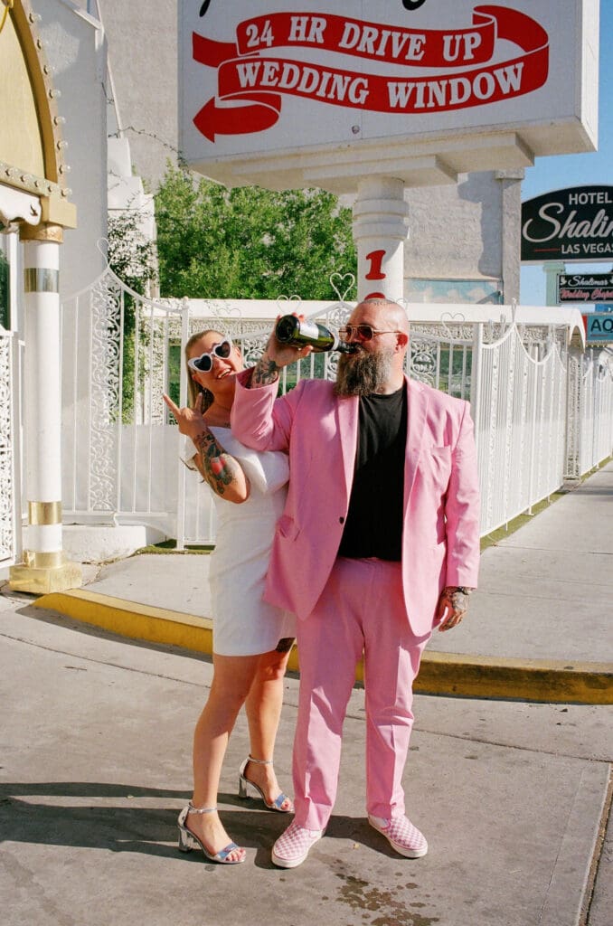 couple celebrating their elopement with champagne