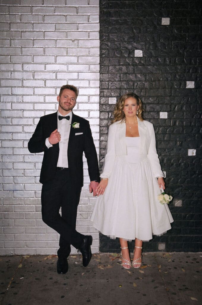 cute picture of the bride and groom holding hands