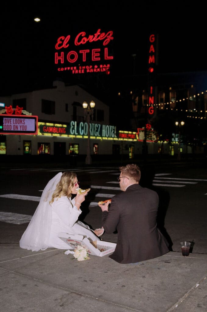 couple celebrating their elopement with pizza